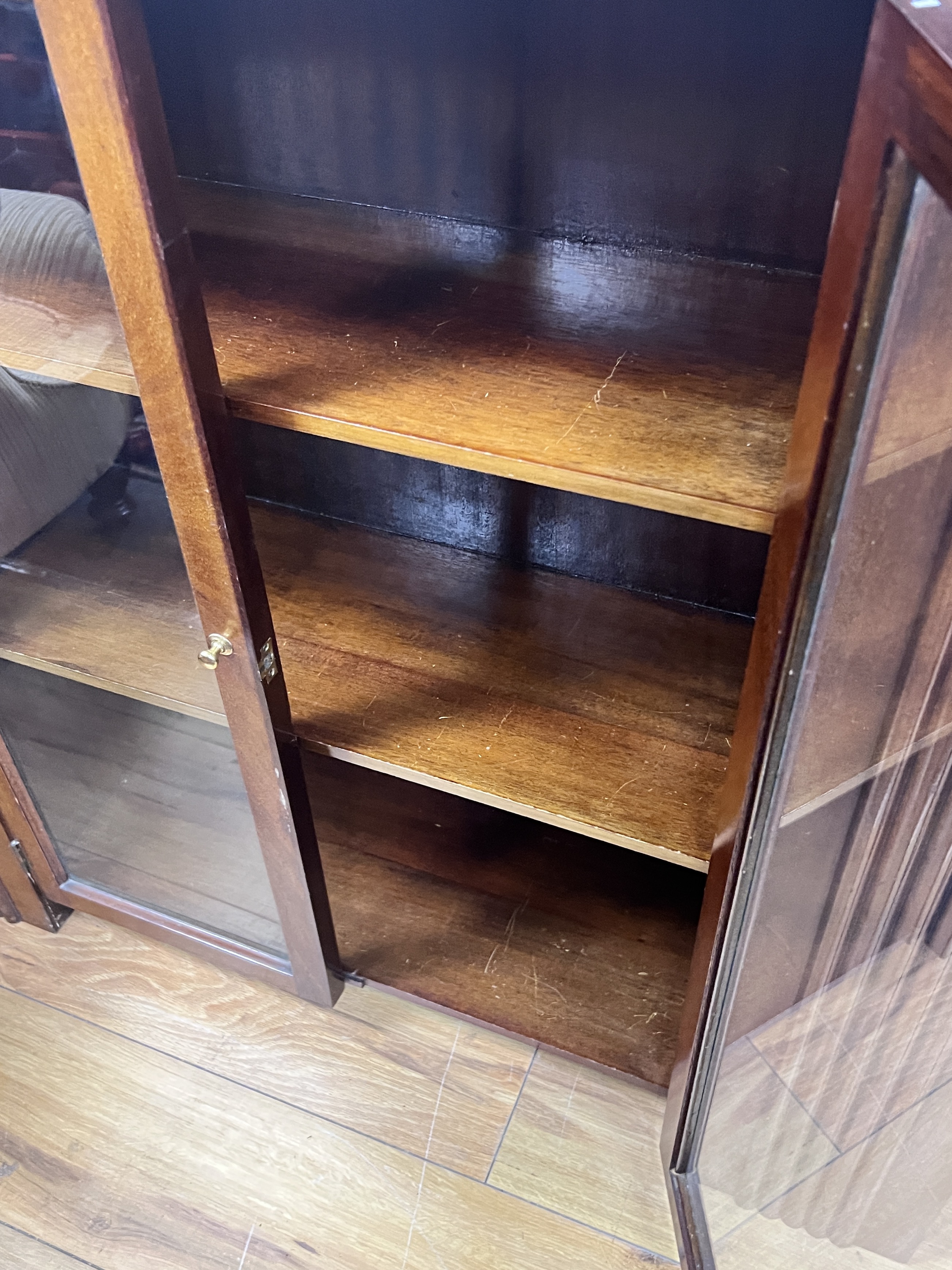 An Art Deco glazed walnut bookcase, width 90cm, depth 25cm, height 91cm